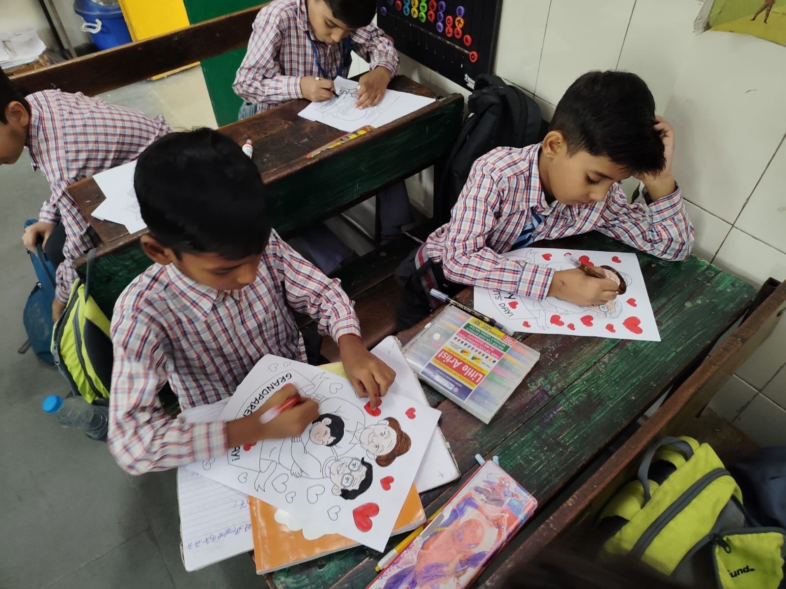 Children proudly showcasing handcrafted artworks